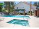 Sparkling community swimming pool, cabana, picnic table, and connected hot tub at 3025 Yankee Clipper Dr, Las Vegas, NV 89117