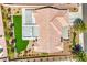 Aerial view of a home showcasing its tile roof, modern patio addition, and pristine artificial grass lawn for low-maintenance living at 3101 Hayden Ct, Las Vegas, NV 89134