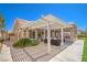 Charming backyard with a covered patio, lush greenery, and well-kept landscaping at 3101 Hayden Ct, Las Vegas, NV 89134