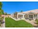 Lush backyard featuring a well-manicured lawn, mature trees, and a private outdoor space at 3101 Hayden Ct, Las Vegas, NV 89134
