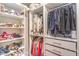 Walk-in closet with custom shelving and hanging rods, providing ample storage for clothes and accessories at 3101 Hayden Ct, Las Vegas, NV 89134