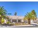 Charming single-story home featuring a desert landscape, palm trees, and a tile roof at 3101 Hayden Ct, Las Vegas, NV 89134