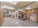 Spacious garage featuring a golf cart, ample storage cabinets, and a utility area at 3101 Hayden Ct, Las Vegas, NV 89134
