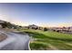 Picturesque golf course winding through the community, set against a backdrop of mountains and a clear sky at 3101 Hayden Ct, Las Vegas, NV 89134