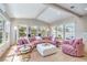 Cozy living room featuring bright windows, hardwood floors, and decorative accent chairs at 3101 Hayden Ct, Las Vegas, NV 89134