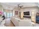 Spacious living room featuring a large sectional sofa, fireplace, stylish lighting, and high ceilings at 3101 Hayden Ct, Las Vegas, NV 89134