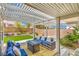 Inviting outdoor patio featuring stylish furniture, a pergola, and well-maintained landscaping at 3101 Hayden Ct, Las Vegas, NV 89134