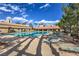 Resort-style swimming pool with lounge chairs and well-maintained grounds, perfect for relaxation at 3101 Hayden Ct, Las Vegas, NV 89134
