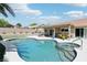 Beautiful backyard with a sparkling pool, spa, covered patio, and well-maintained landscaping at 3249 Palmdesert Way, Las Vegas, NV 89120