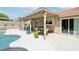 Inviting backyard featuring a covered patio, pool, and outdoor seating for ultimate enjoyment at 3249 Palmdesert Way, Las Vegas, NV 89120