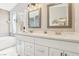 Stylish bathroom featuring double sinks, quartz countertops, and modern fixtures at 3249 Palmdesert Way, Las Vegas, NV 89120