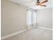 Bright bedroom features neutral walls, plush carpeting, and a ceiling fan for added comfort at 3249 Palmdesert Way, Las Vegas, NV 89120