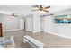 Large bedroom with wood-look tile floors and a barn door accent at 3249 Palmdesert Way, Las Vegas, NV 89120