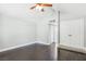 Bedroom featuring vaulted ceilings, ceiling fan, dark wood floors, and a closet at 3249 Palmdesert Way, Las Vegas, NV 89120