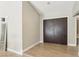 Bright foyer with wood-look tile floor and double door entry, offering a warm welcome at 3249 Palmdesert Way, Las Vegas, NV 89120