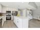 Bright kitchen features a center island, stainless steel appliances, and white cabinetry at 3249 Palmdesert Way, Las Vegas, NV 89120