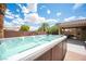 Backyard features a spa and a covered patio at 3696 Waynesvill St, Las Vegas, NV 89122