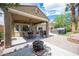 Covered patio area with outdoor seating, barbecue grill, and hot tub at 3696 Waynesvill St, Las Vegas, NV 89122