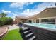 Beautiful backyard featuring a spa and artificial grass at 3696 Waynesvill St, Las Vegas, NV 89122
