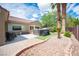 Well-maintained backyard with a hot tub, desert landscaping, and privacy walls at 3696 Waynesvill St, Las Vegas, NV 89122