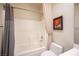 Well-lit bathroom featuring a tub, shower, and neutral-colored walls at 3696 Waynesvill St, Las Vegas, NV 89122