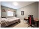A cozy bedroom features a desk and chair, offering a comfortable living space at 3696 Waynesvill St, Las Vegas, NV 89122