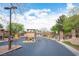 Community entrance with lush landscaping and well-maintained entryway at 3696 Waynesvill St, Las Vegas, NV 89122