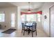 Charming breakfast nook featuring a round table, bright windows, and tiled flooring at 3696 Waynesvill St, Las Vegas, NV 89122