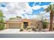 Charming single-story home with a well-manicured front yard, desert landscaping, and a tile roof at 3696 Waynesvill St, Las Vegas, NV 89122