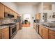 Well-equipped kitchen boasts stainless steel appliances, granite countertops, and ample cabinet space at 3696 Waynesvill St, Las Vegas, NV 89122