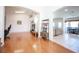 Spacious living room with hardwood floors, arched doorways, and an open floor plan at 3696 Waynesvill St, Las Vegas, NV 89122
