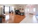 Open-concept living area with hardwood floors, arched doorways, and a view of the front entrance at 3696 Waynesvill St, Las Vegas, NV 89122