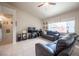 Open living room with neutral paint, large window, and tile flooring at 3696 Waynesvill St, Las Vegas, NV 89122