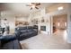 Spacious living area with a fireplace, wet bar, and open layout to the kitchen at 3696 Waynesvill St, Las Vegas, NV 89122