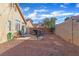 Spacious backyard featuring a patio, seating, and charming string lights at 3741 Round Robin St, North Las Vegas, NV 89032