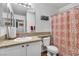 Cozy bathroom featuring a decorative shower curtain and granite countertop at 3741 Round Robin St, North Las Vegas, NV 89032