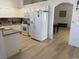 Bright kitchen area featuring white appliances, counter tops, and hardwood floors at 3741 Round Robin St, North Las Vegas, NV 89032