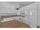 A well-lit kitchen with white appliances, granite countertops, and ample storage at 3741 Round Robin St, North Las Vegas, NV 89032