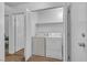 Convenient laundry area with white washer and dryer units at 3741 Round Robin St, North Las Vegas, NV 89032