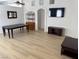 Bright and airy living room featuring wood-look floors and modern entertainment setup at 3741 Round Robin St, North Las Vegas, NV 89032