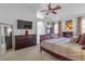 Spacious main bedroom featuring a ceiling fan, vaulted ceiling, and ample natural light at 3741 Round Robin St, North Las Vegas, NV 89032