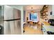 Bright dining area features tile floors and modern decor with a stainless steel refrigerator in the background at 4338 Caliente St # 11, Las Vegas, NV 89119