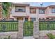 Inviting townhome featuring secure gated entry and lush greenery at 4338 Caliente St # 11, Las Vegas, NV 89119