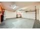 Large garage interior with ample room for vehicles and storage, lit by overhead lighting at 4338 Caliente St # 11, Las Vegas, NV 89119
