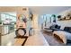 Open-concept living area with modern decor, seamless flow into kitchen, and staircase at 4338 Caliente St # 11, Las Vegas, NV 89119