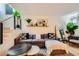 Inviting living room featuring a comfortable couch, stylish coffee tables and floating shelves at 4338 Caliente St # 11, Las Vegas, NV 89119