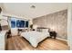 Spacious main bedroom has a desk, chair, nightstands and a bed at 4338 Caliente St # 11, Las Vegas, NV 89119