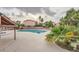 Beautiful community pool with palm trees, surrounded by ample deck space at 4338 Caliente St # 11, Las Vegas, NV 89119