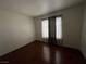 A Simple bedroom with hardwood floors, large windows, and neutral walls, creating a blank canvas for your design ideas at 4555 E Sahara Ave # 166, Las Vegas, NV 89104