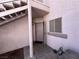 Entryway featuring stucco walls, an open door, and a concrete staircase leading up to the next level at 4555 E Sahara Ave # 166, Las Vegas, NV 89104